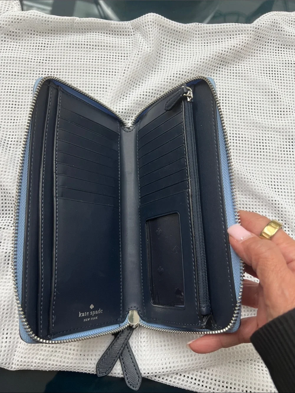kate spade navy zip-around leather wallet with blue trim